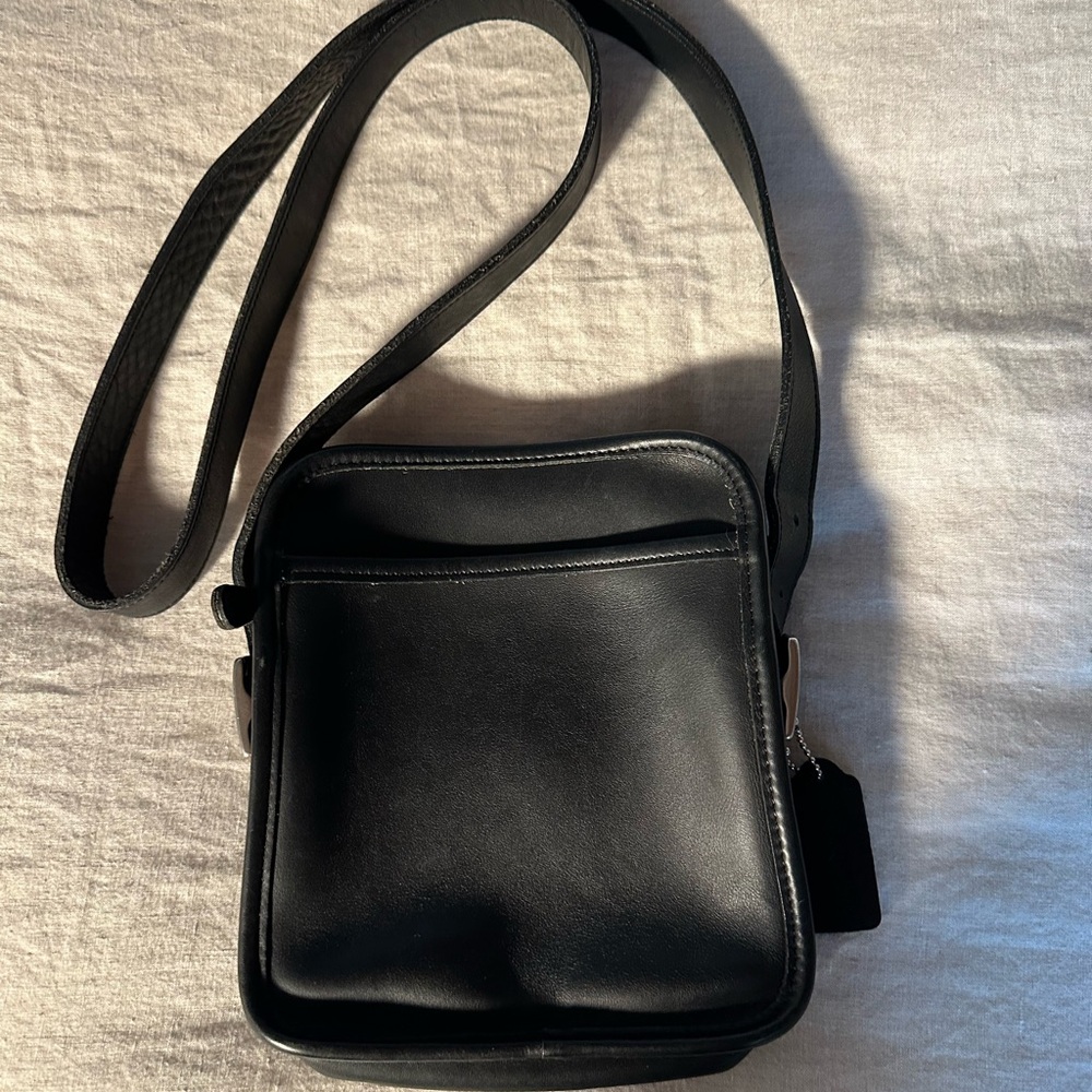 Coach “camera” bag.  Black leather. Silver accents.